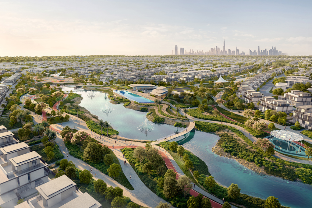 Aerial view of Emaar master communities 2025 with modern villas, apartment buildings, landscaped gardens, and clear blue sky, showcasing luxury residential neighborhoods in Dubai